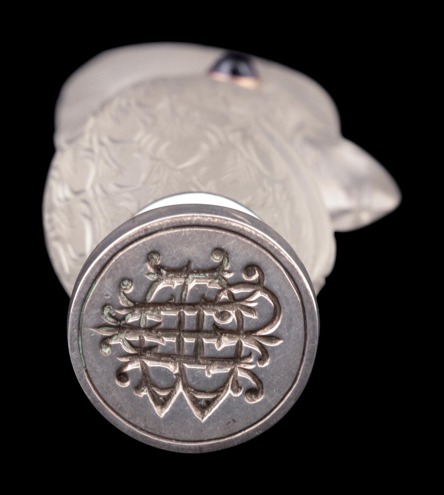 A Continental Carved Rock Crystal and Guilloche Enamel-Mounted Cockatiel-Form Hand Seal