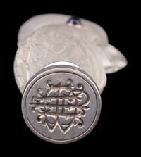 A Continental Carved Rock Crystal and Guilloche Enamel-Mounted Cockatiel-Form Hand Seal