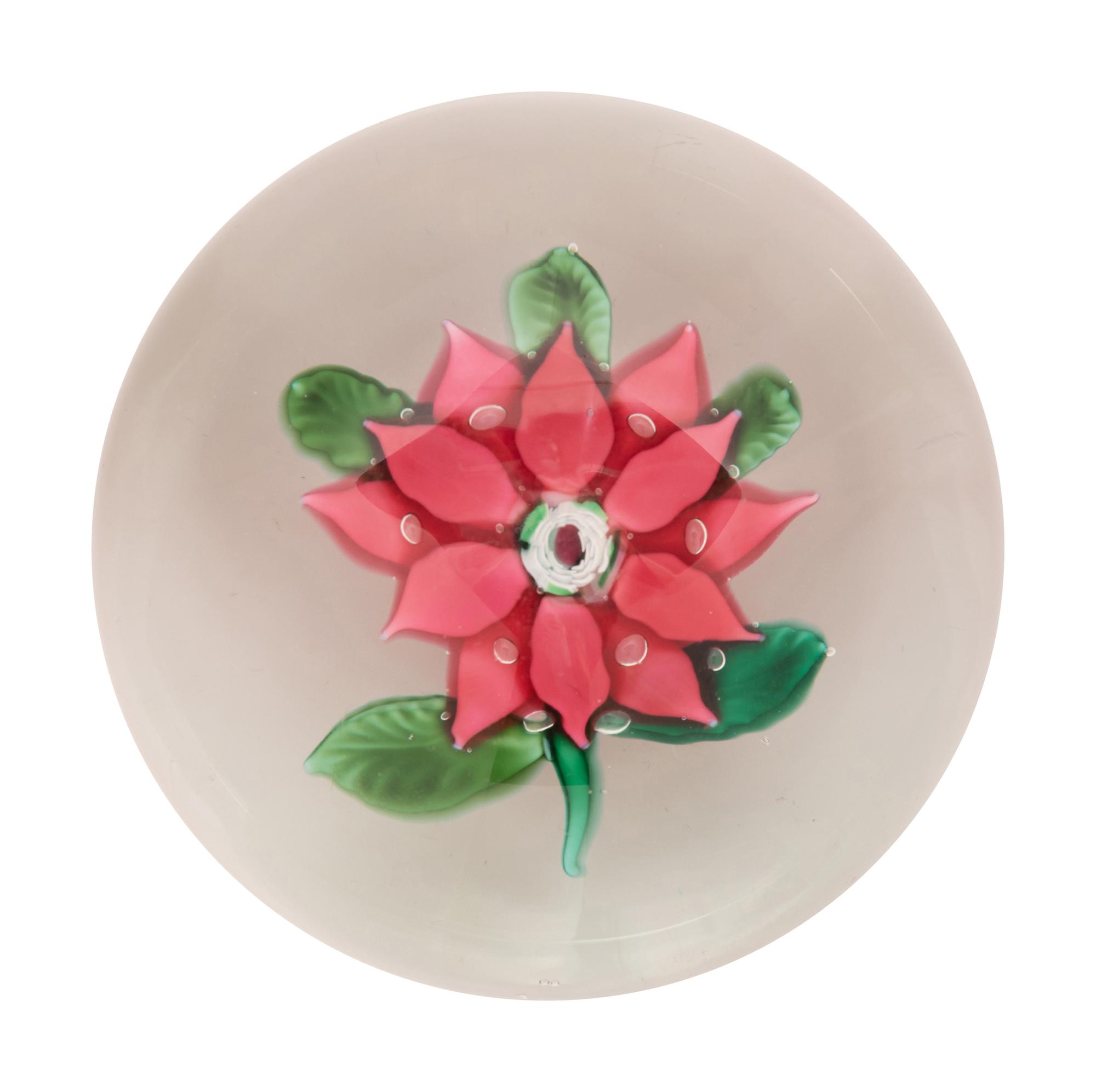 A Magenta Poinsettia Glass Paperweight