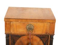A Northern Italian Walnut and Ebonized Bedside Cabinet