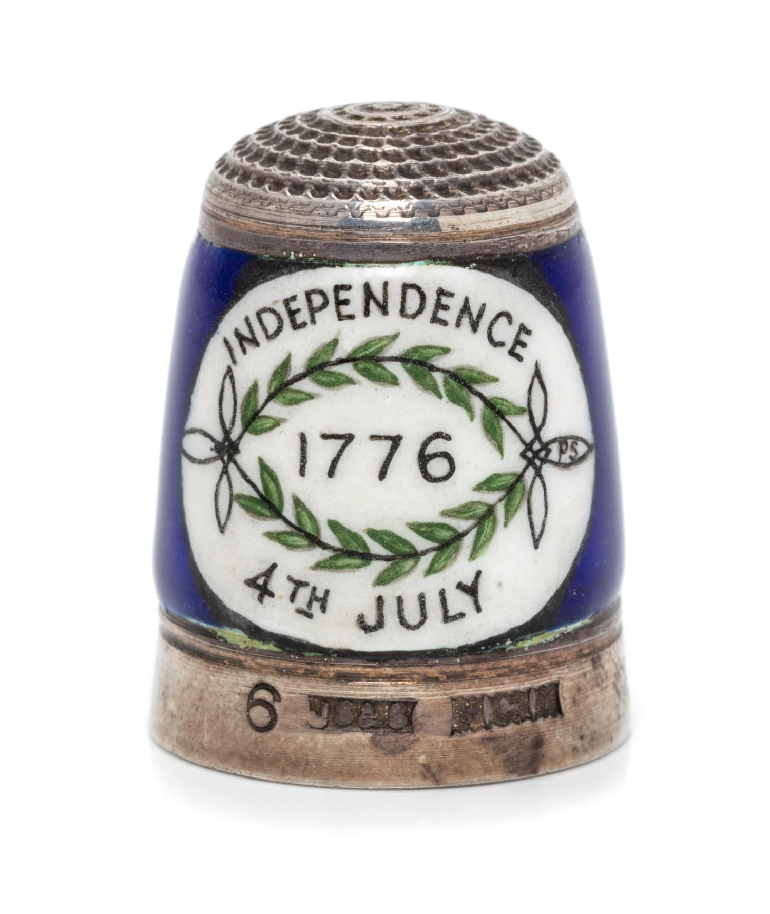 An English Silver and Enamel Thimble, Joseph Swan & Sons, Birmingham, 1973, the knurled top above an enamel band depicting George and M