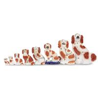 A large collection of seated Staffordshire dog figures 19th/20th centuries