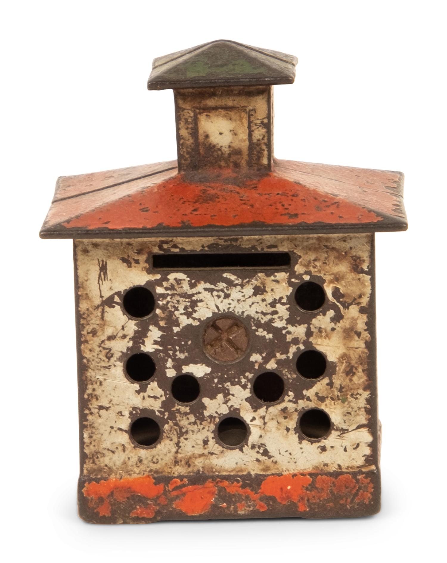 An Old Honesty Cast Iron Indian Cigar Bank, PLUS