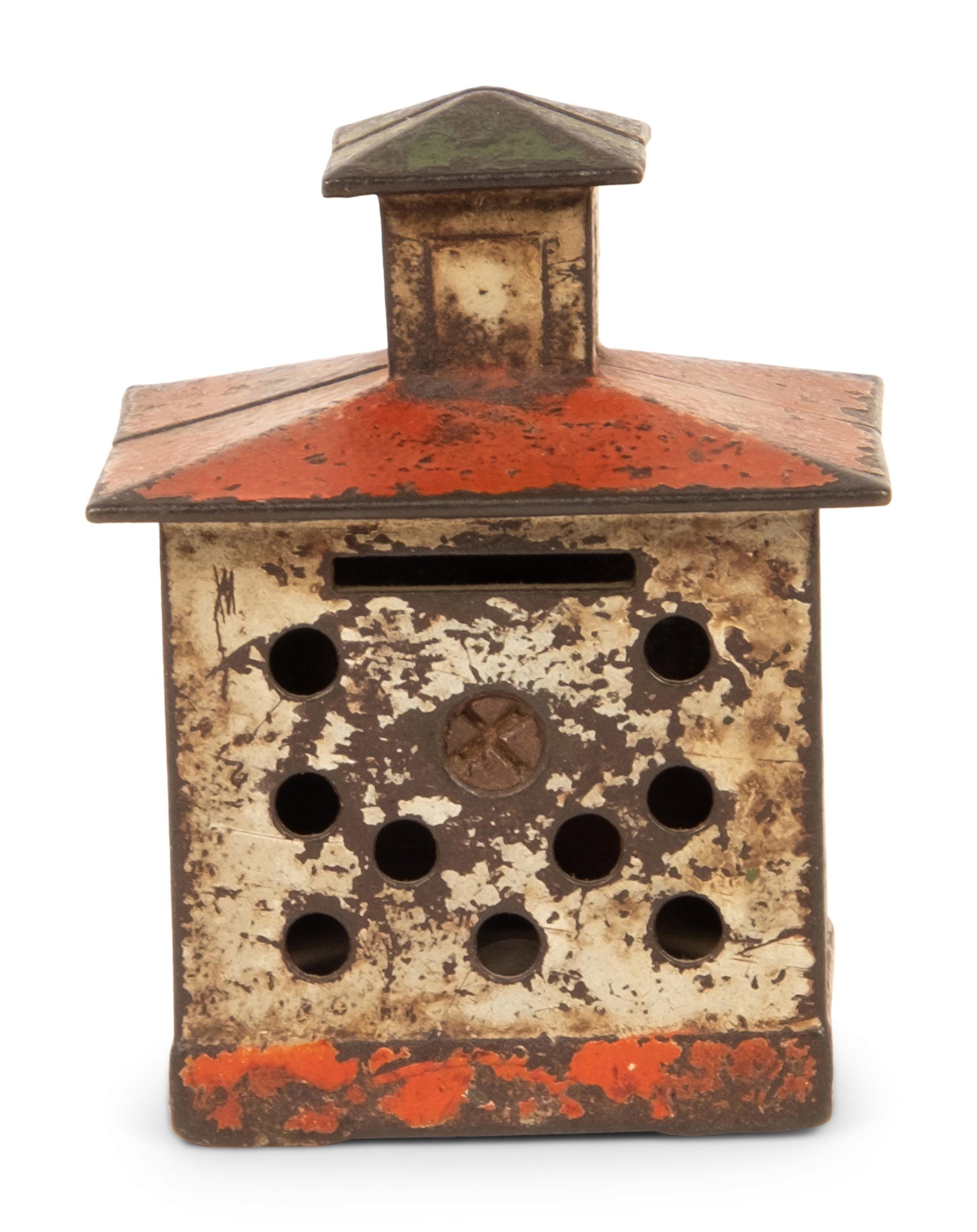 An Old Honesty Cast Iron Indian Cigar Bank, PLUS