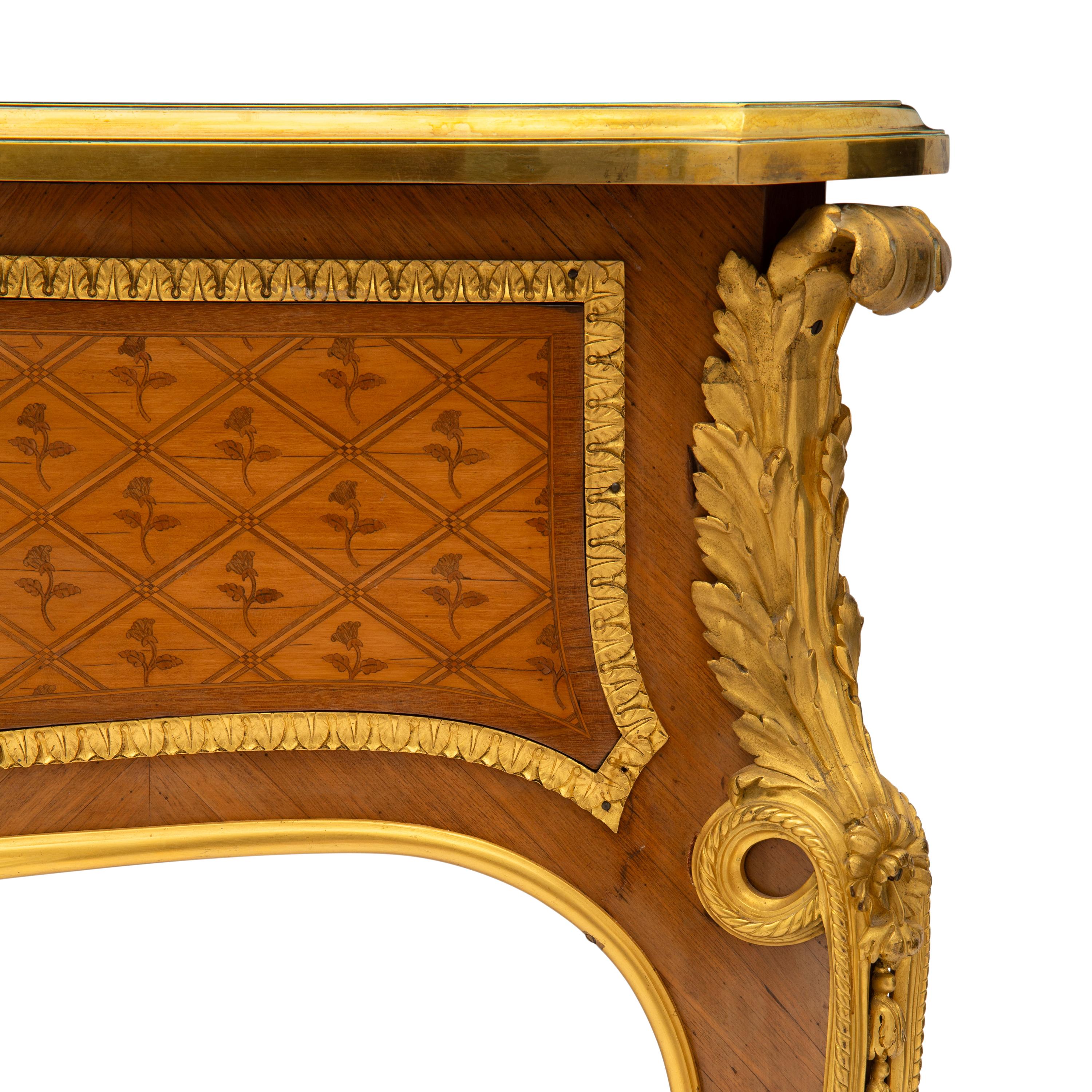 A Louis XVI Style Marquetry and Gilt Bronze Mounted Bureau Plat
