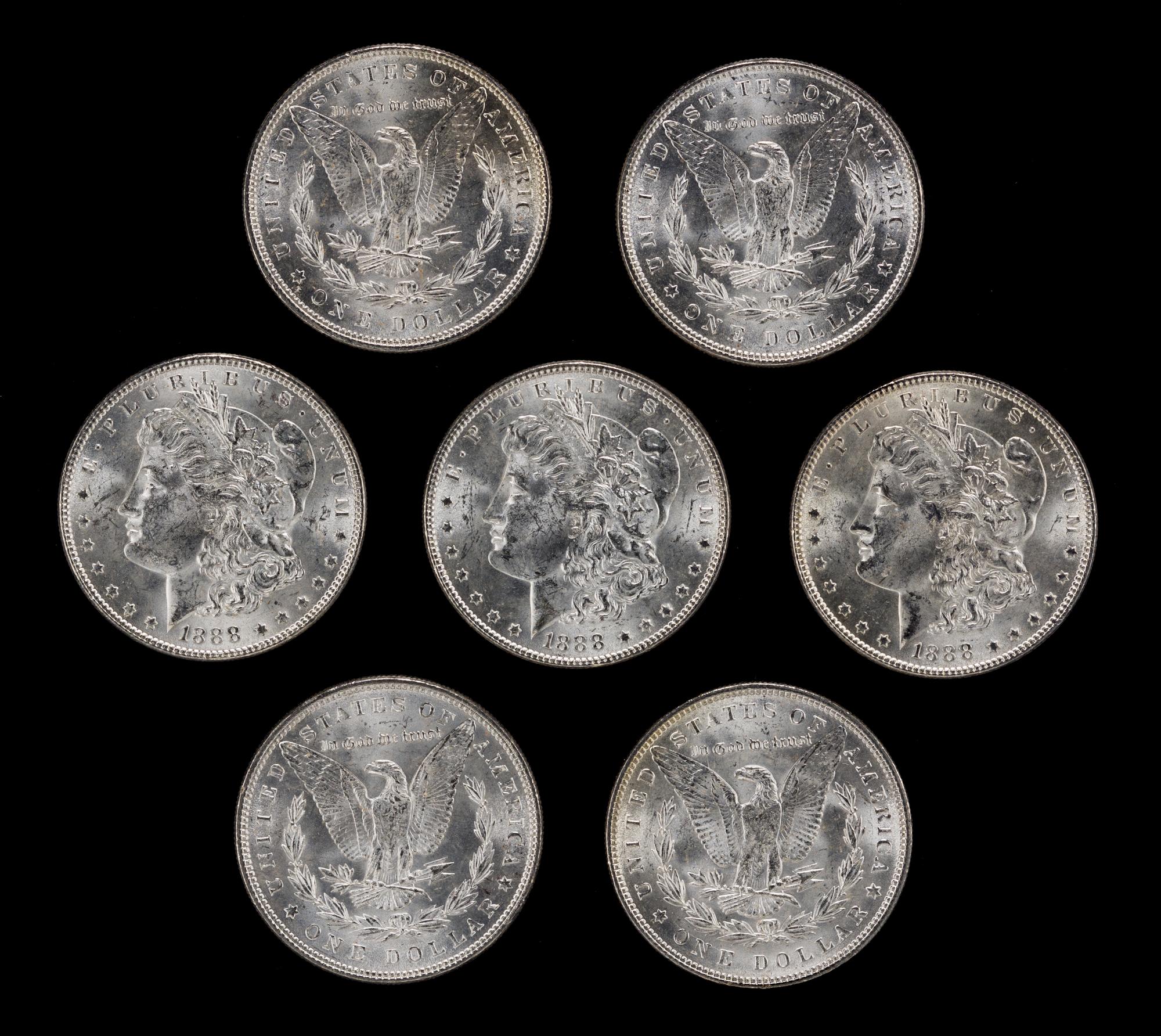 A Group of Seven United States 1888 Morgan Silver Dollar Coins