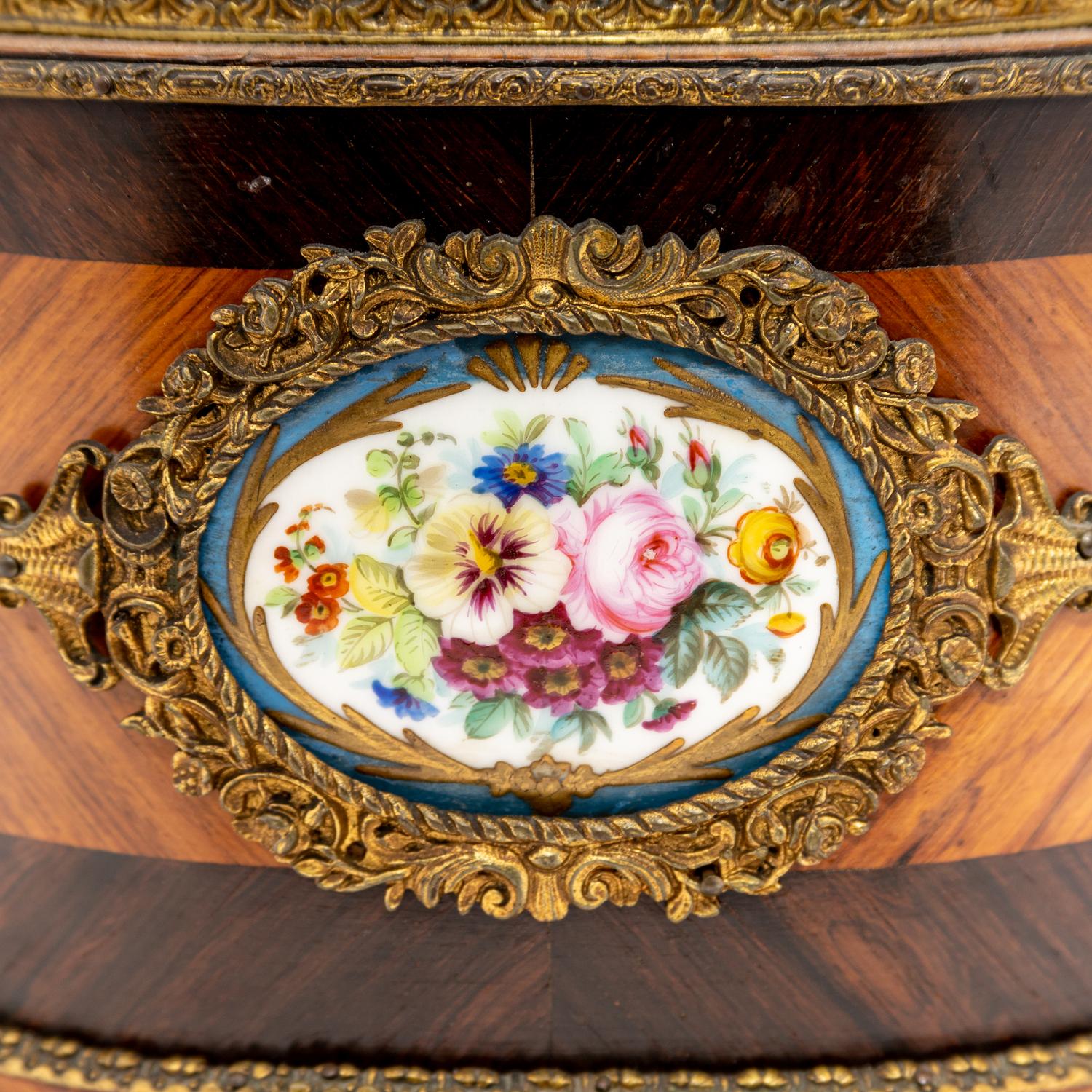 A French Porcelain and Gilt Bronze Mounted Kingwood Jardinière