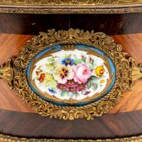 A French Porcelain and Gilt Bronze Mounted Kingwood Jardinière