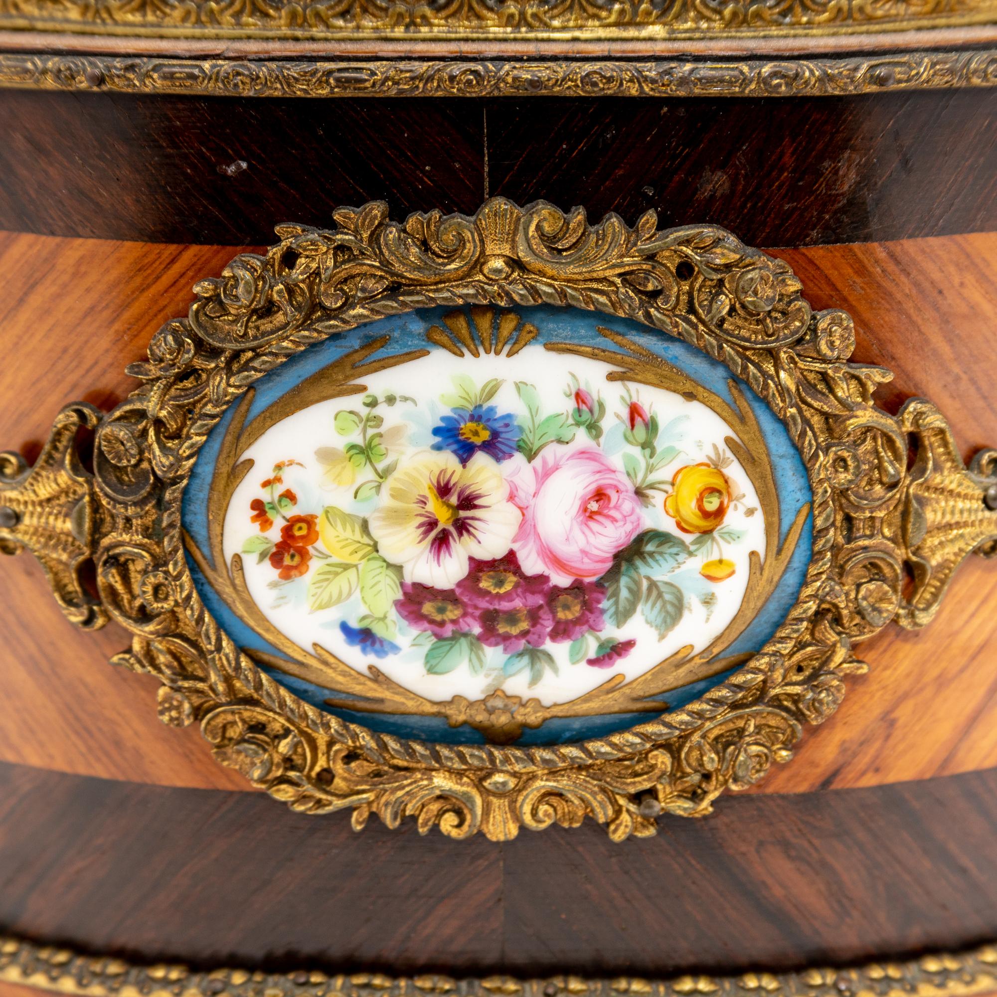 A French Porcelain and Gilt Bronze Mounted Kingwood Jardinière