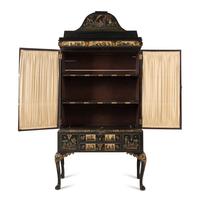 A Queen Anne Style Polychrome and Black Japanned Bookcase on Stand