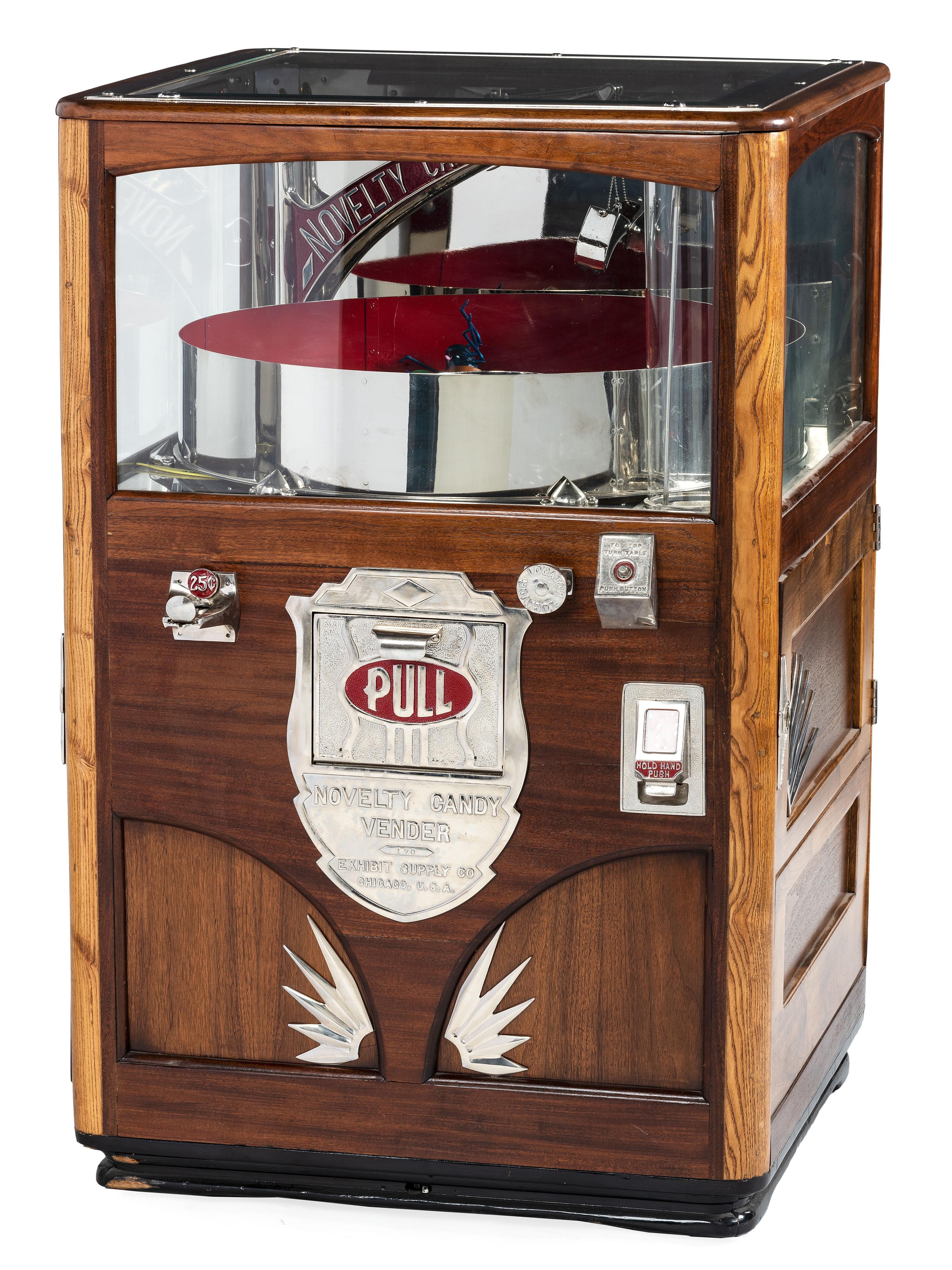 An Exhibit Supply Co. Novelty Candy Vender Claw Machine