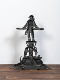 A Victorian Cold Painted Iron Umbrella Stand with Sailor Figure