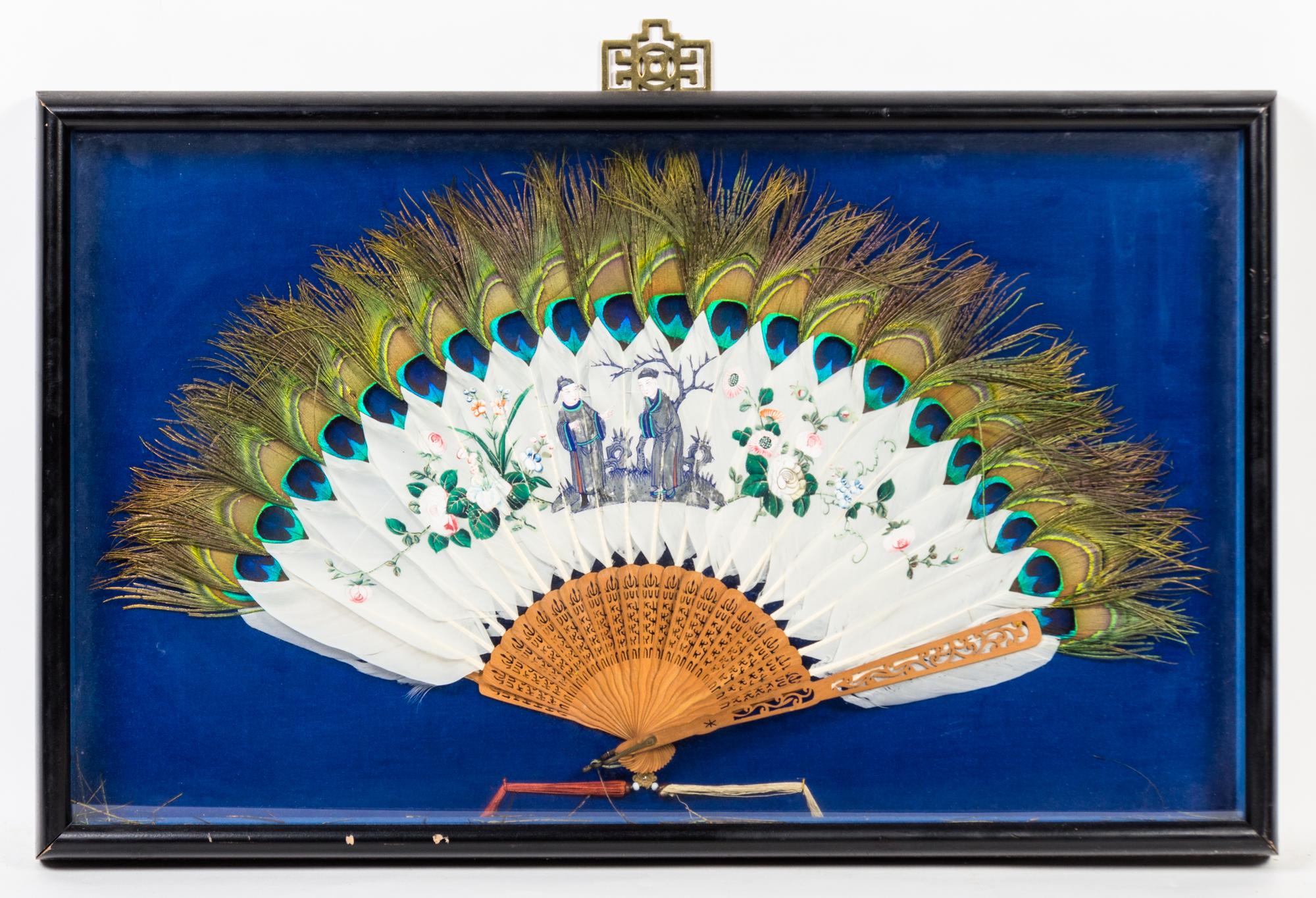A Chinese Export Painted Peacock Feather Fan Width of fan 24 inches.