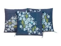 A Group of Three Upholstered Throw Pillows
