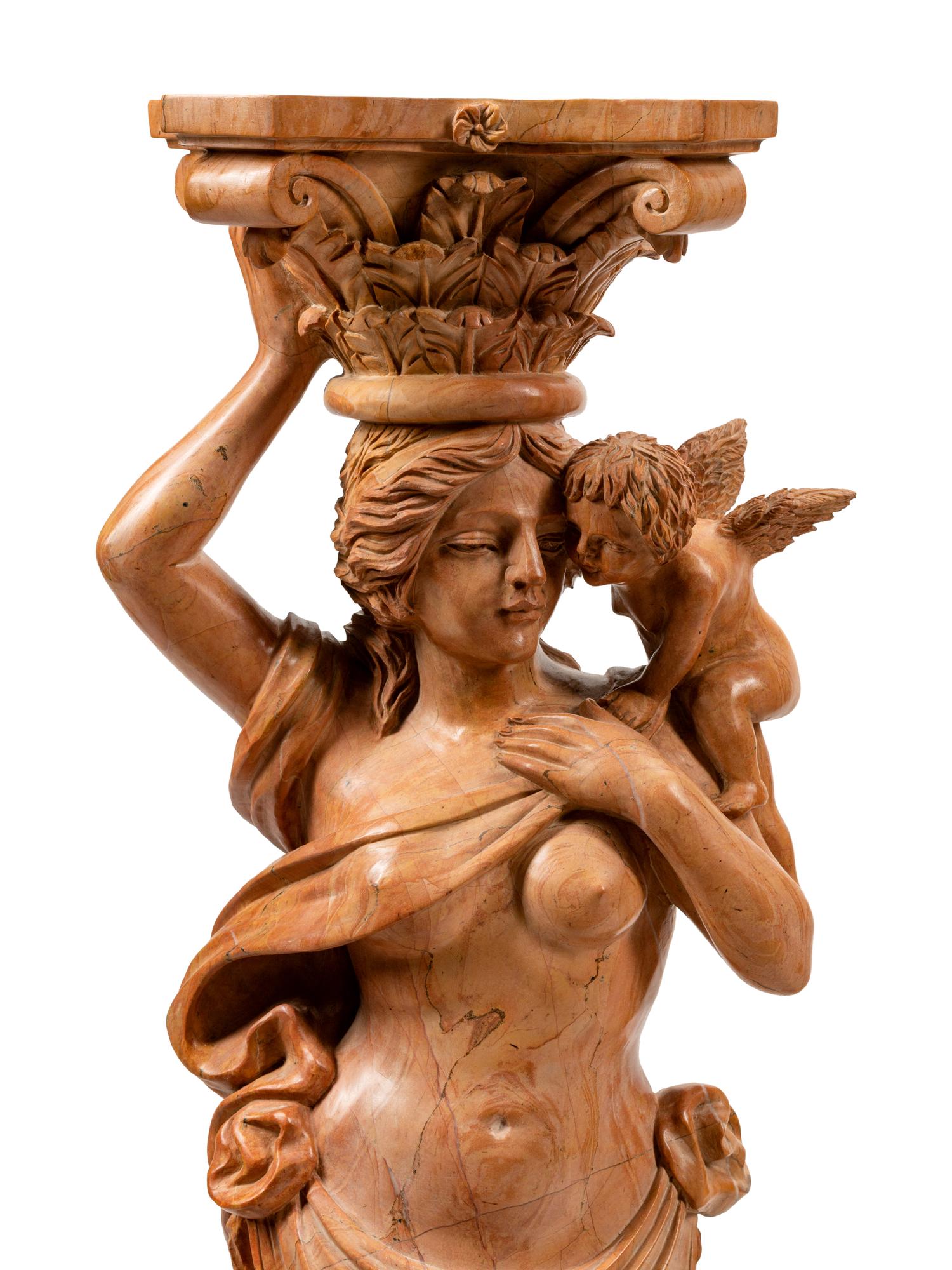 A Pair of Carved Marble Figural Pedestals