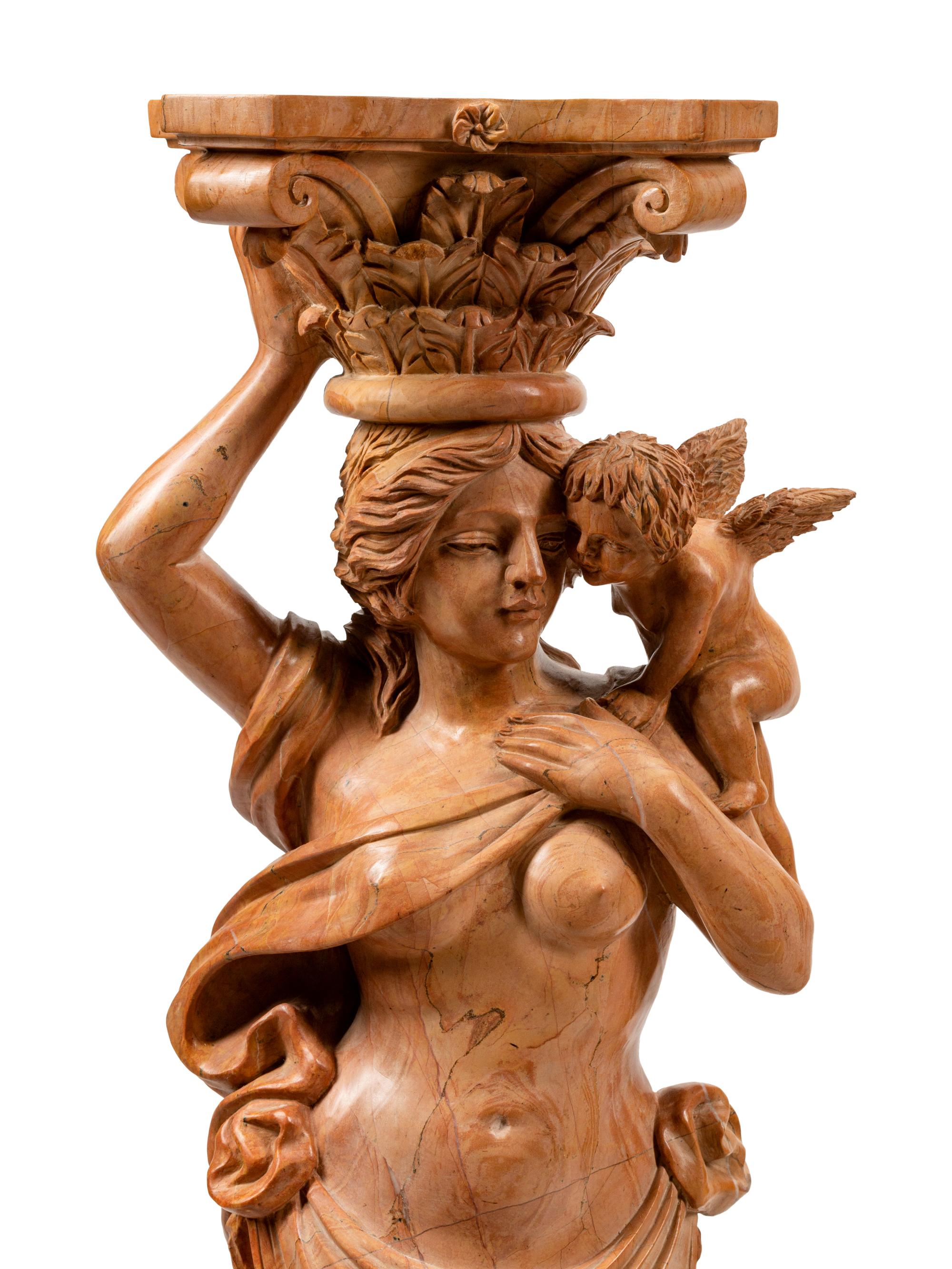 A Pair of Carved Marble Figural Pedestals