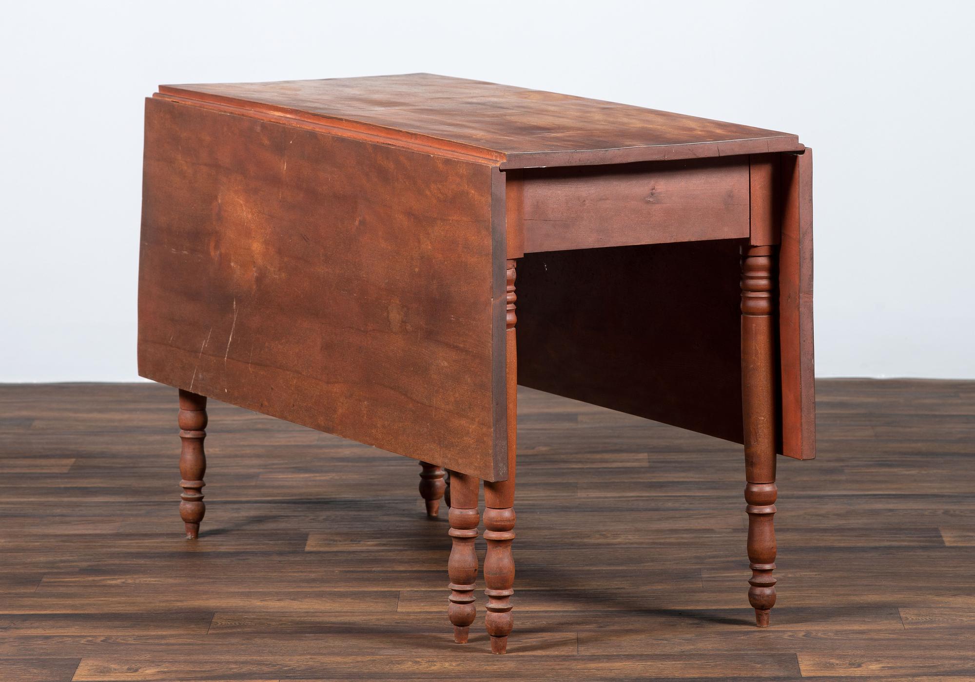 A Late Federal Cherrywood Drop-Leaf Dining Table