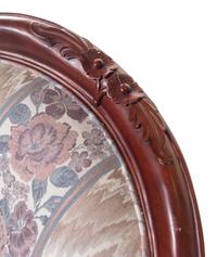 A Pair of Victorian Style Carved Walnut Armchairs