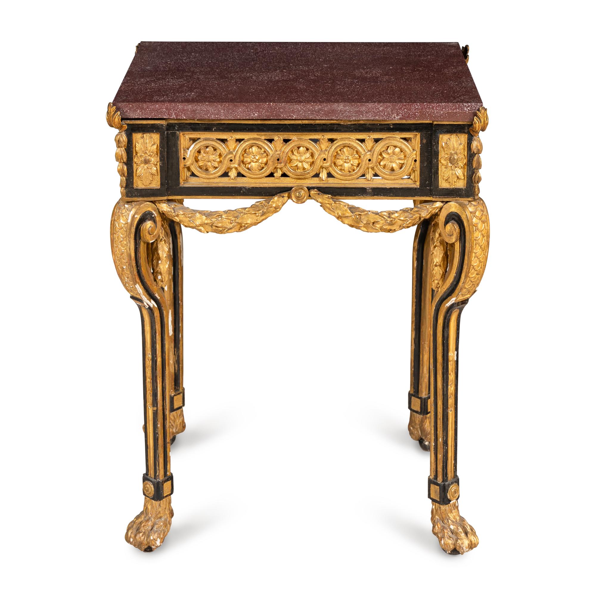 A Neoclassical Style Gilt Bronze Mounted Parcel-Gilt, Ebonized and Porphyry-Top Center Table