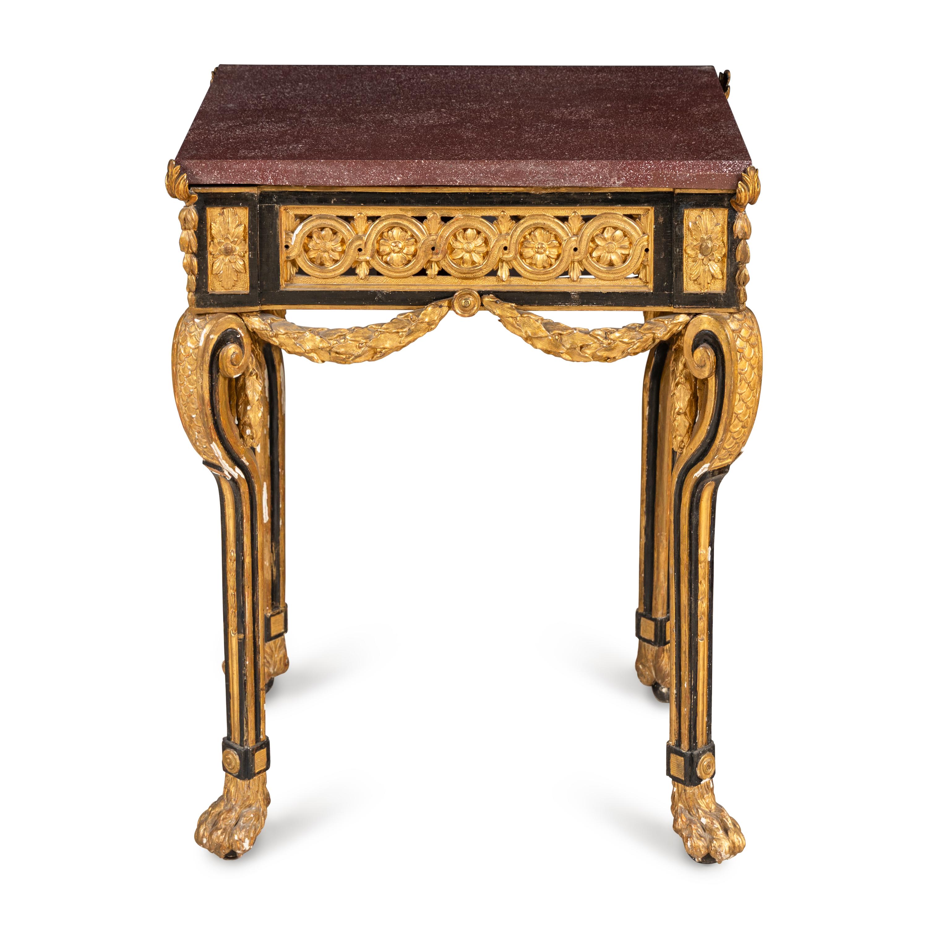 A Neoclassical Style Gilt Bronze Mounted Parcel-Gilt, Ebonized and Porphyry-Top Center Table