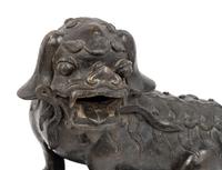 A Pair of Chinese Bronze Buddhistic Lions with Wood Stands