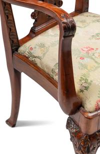 A Set of Fourteen George III Style Carved Mahogany Dining Chairs