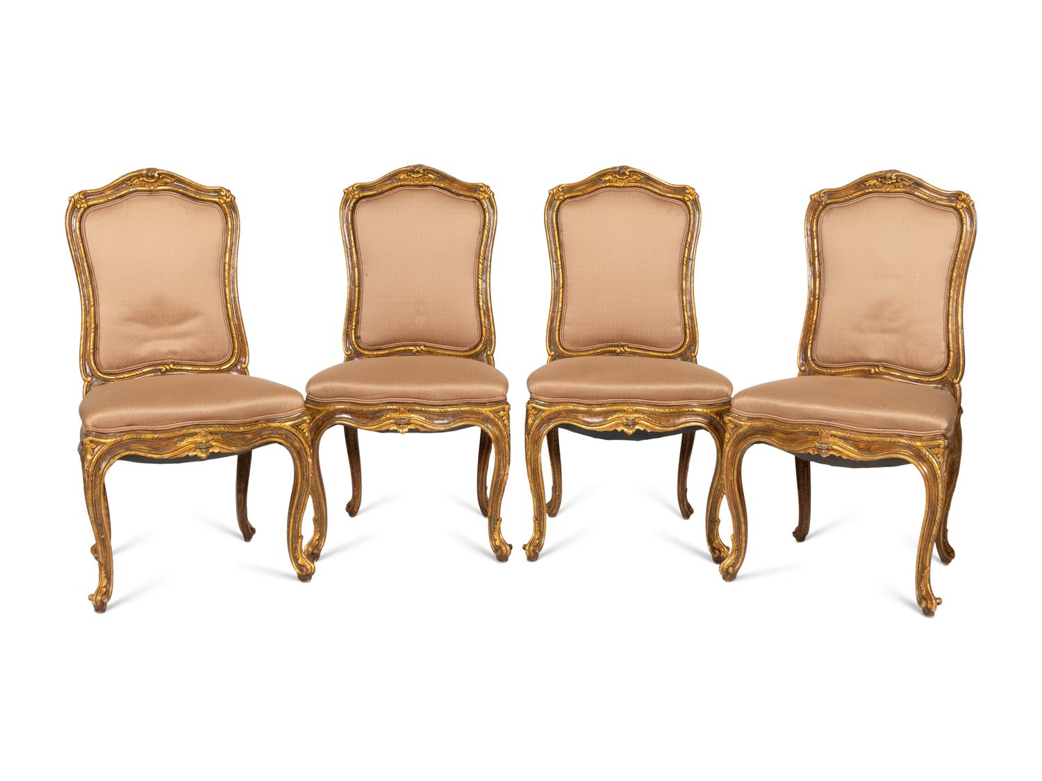 A Set of Four Louis XV Style Painted and Parcel Gilt Dining Chairs