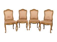 A Set of Four Louis XV Style Painted and Parcel Gilt Dining Chairs