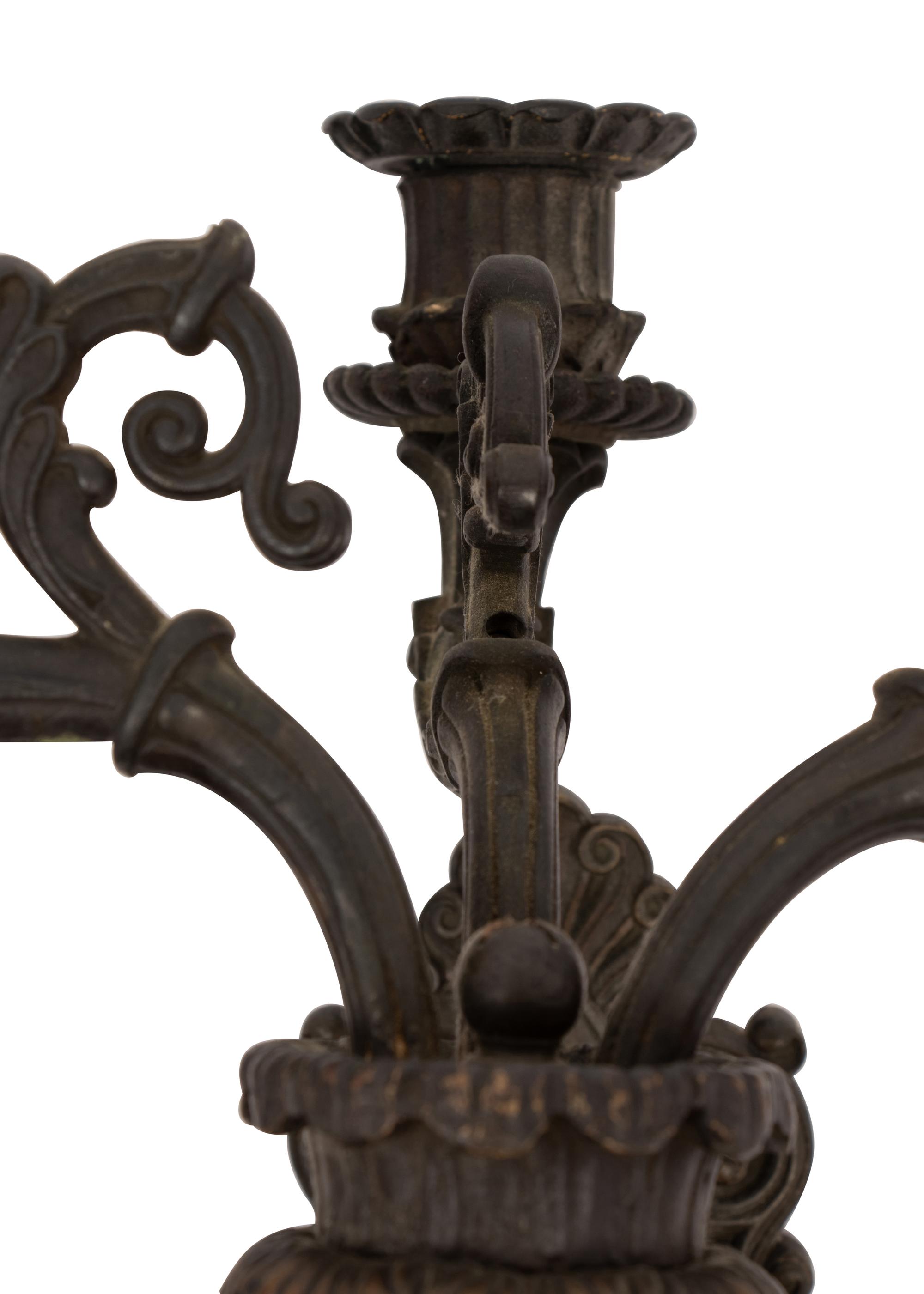 A Pair of Neoclassical Patinated Metal Three-Light Wall Sconces