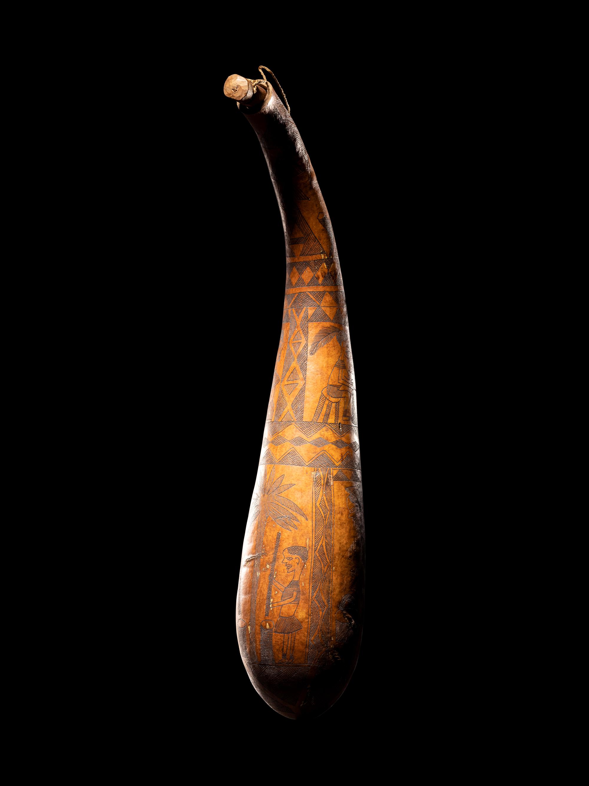 A Maasai Painted Hide Shield and Milk Gourd