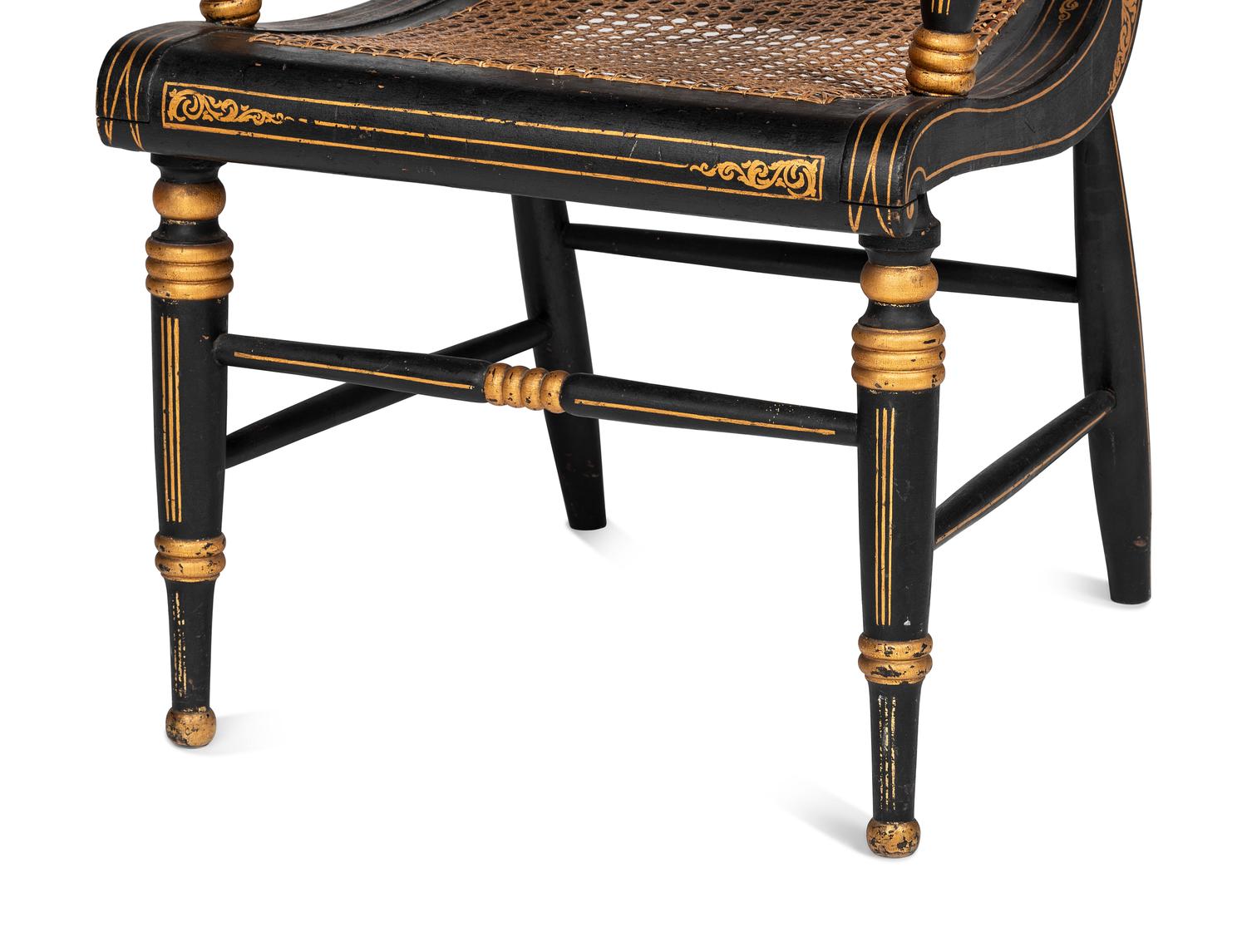 A Classical Carved, Painted and Parcel Gilt Wood Cane Seat Hitchcock Armchair