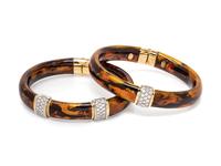 A Pair of 18 Karat Bicolor Gold, Diamond and Enamel Bangles, Soho,