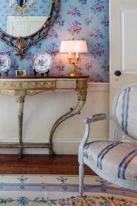 A Pair of Paris Porcelain Pink-Ground Vine-Decorated Candlesticks and a Jardinière