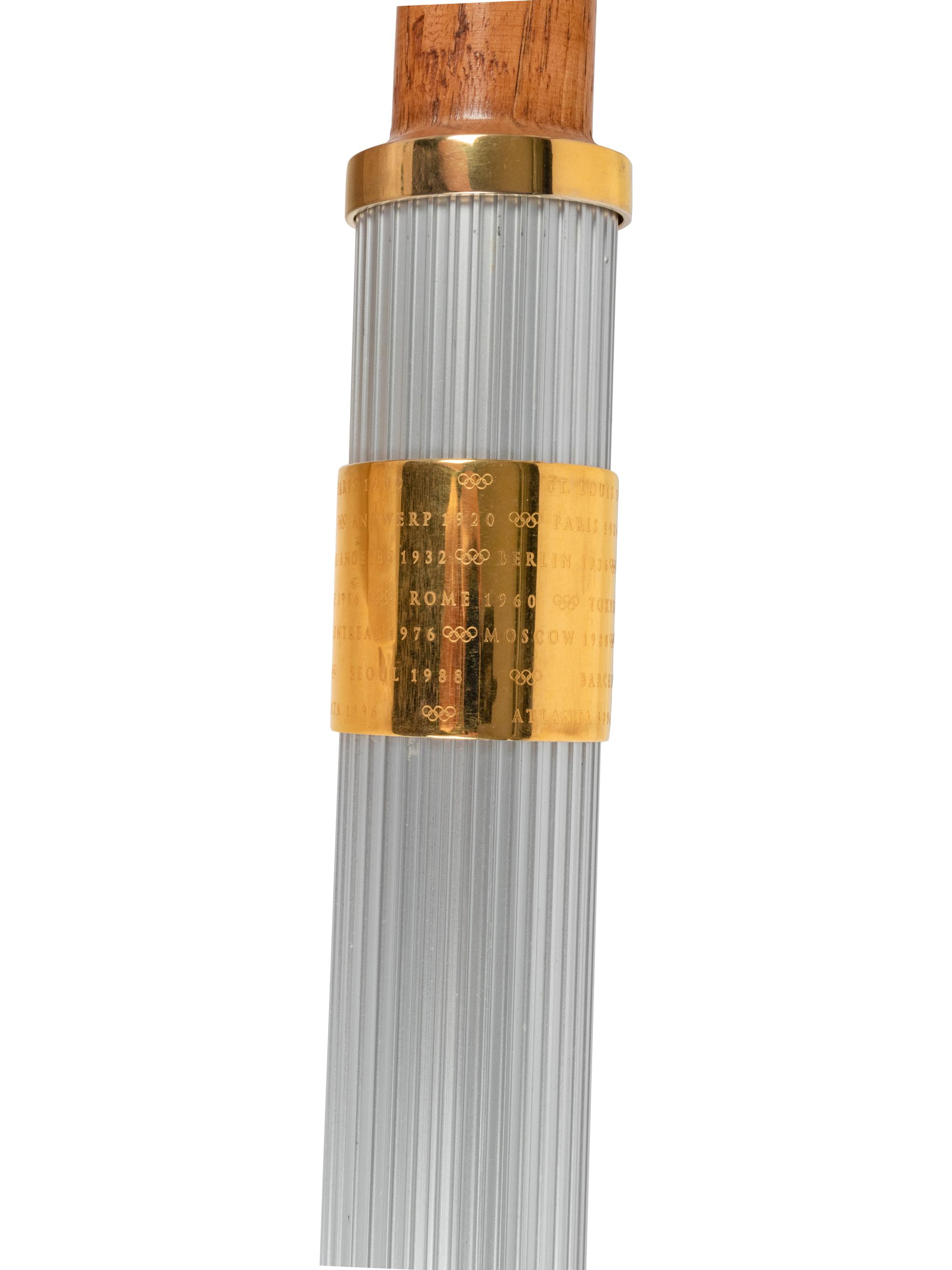 A 1996 Atlanta Olympics Torch and Assorted Relay Used Items by 1964 United States Basketball Team Gold Medal Winner George Wilson,