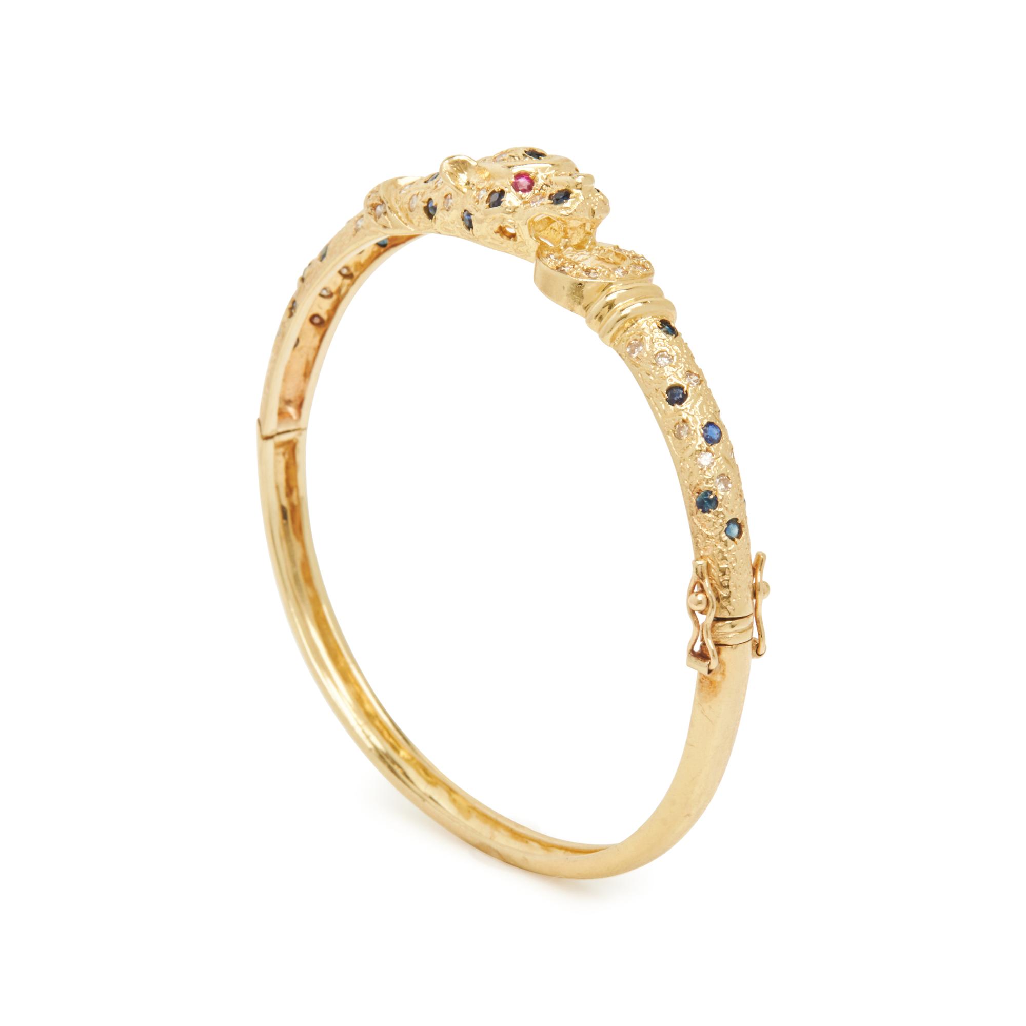 YELLOW GOLD AND GEMSTONE PANTHER BANGLE BRACELET