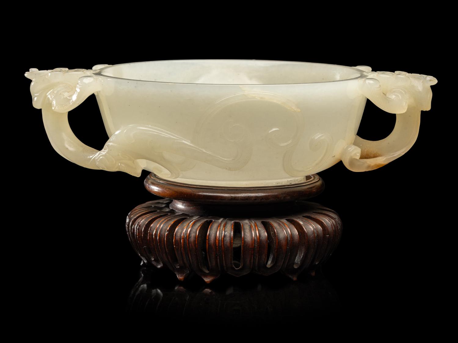 A Chinese Carved White Jade 'Chilong' Handled Cup, 19th/Early 20th Century 晚清/民國 白玉螭龍雙耳杯