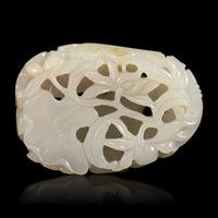 A Chinese White and Russet Jade 'Lotus' Pendant, 18th/19th Century — 清中期 白玉帶皮鏤雕蓮塘荷葉佩