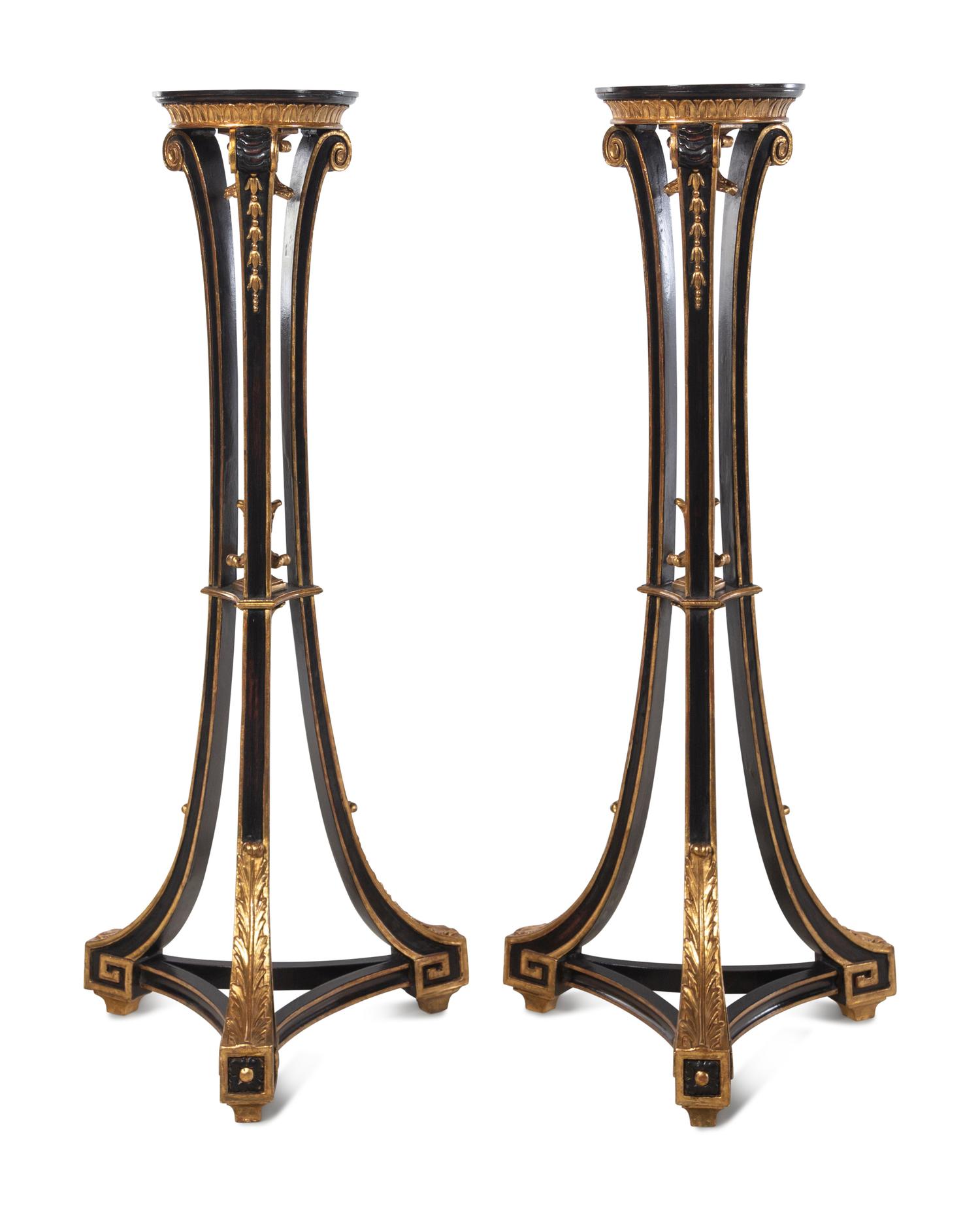 A Pair of Regency Style Black Painted and Parcel Gilt Pedestals