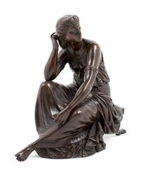 A Continental Patinated Bronze Seated Maiden