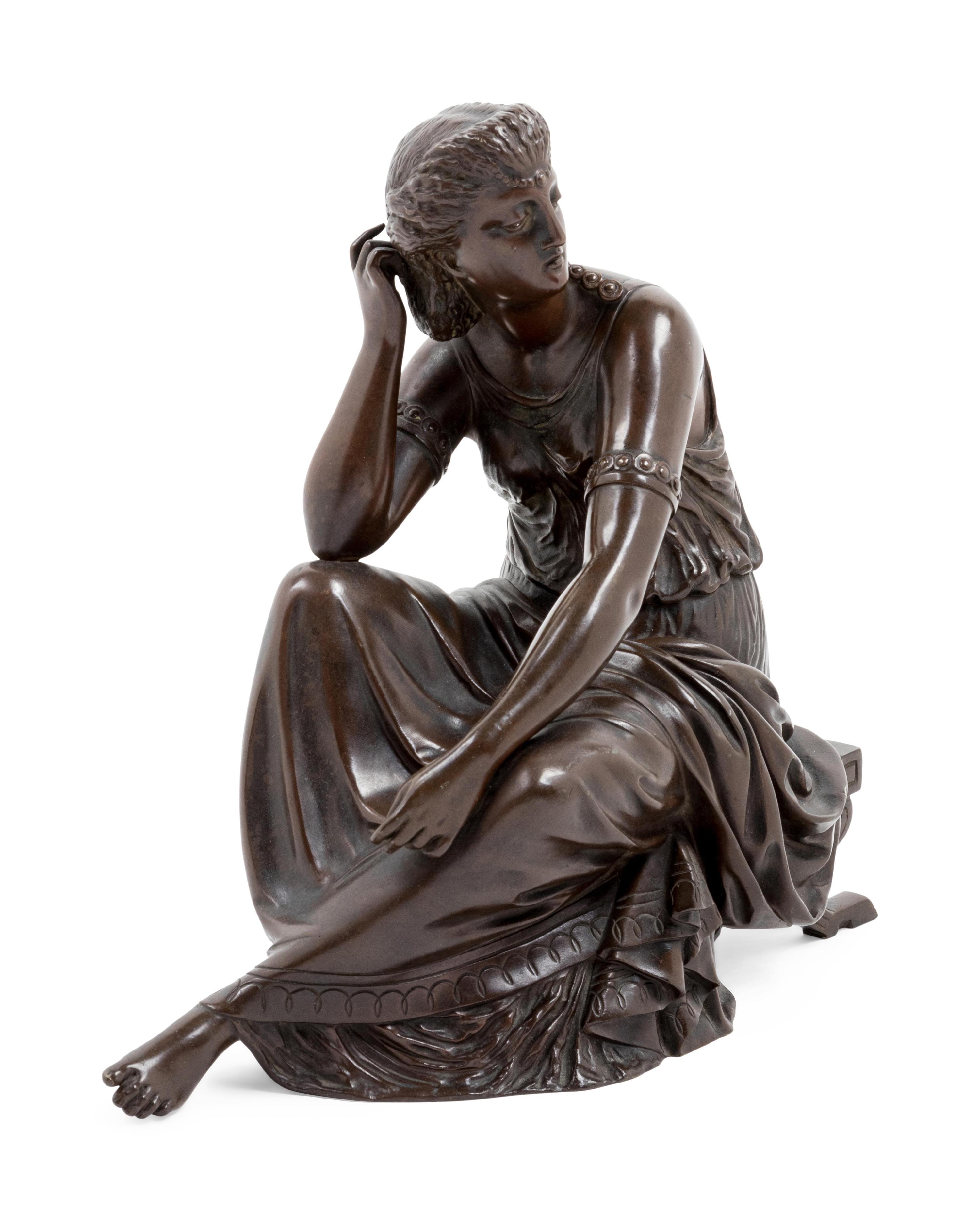 A Continental Patinated Bronze Seated Maiden