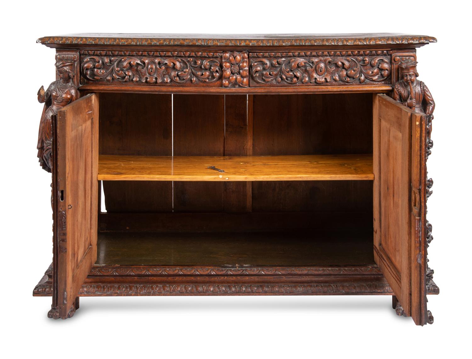 A Continental Carved Oak Cabinet