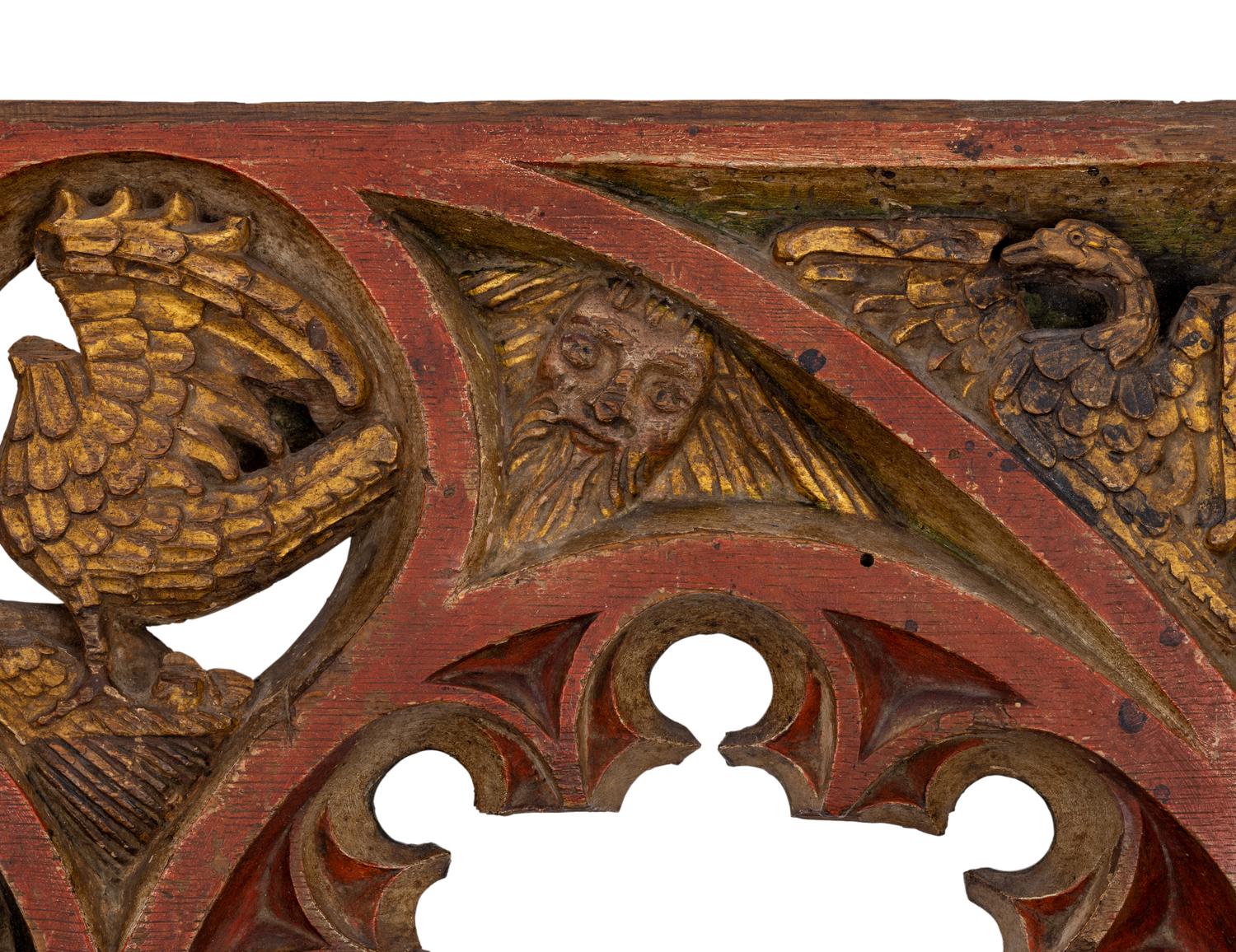 A Gothic Style Painted and Parcel Gilt Relief Panel