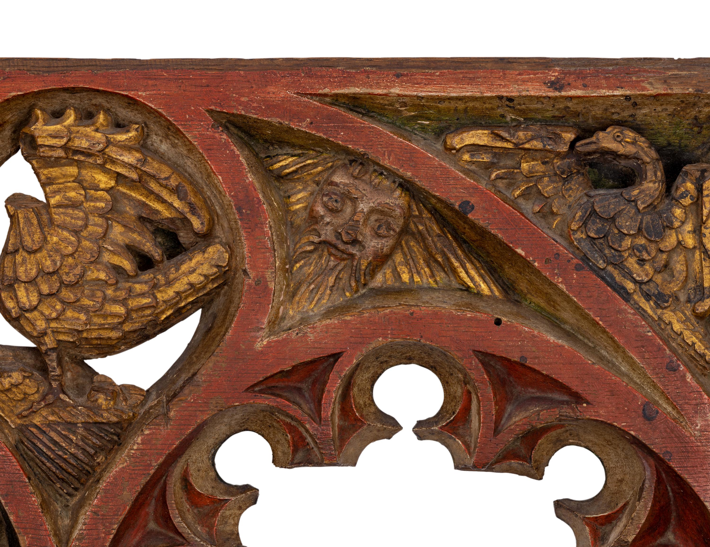 A Gothic Style Painted and Parcel Gilt Relief Panel