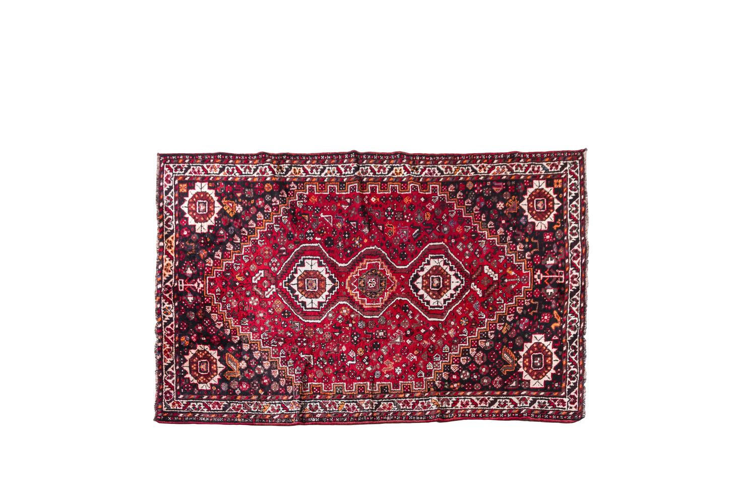 A Persian Wool Rug 8 feet 4 inches x 5 feet 1 inch.