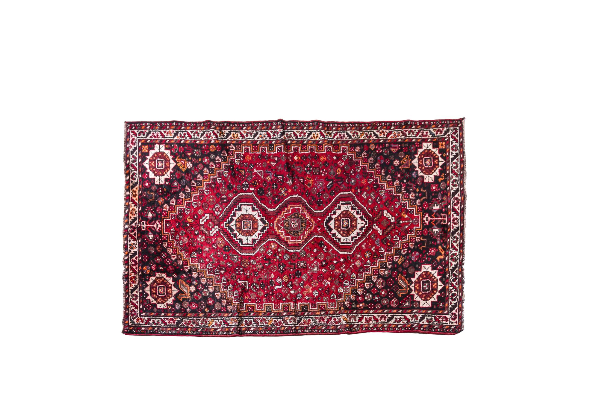 A Persian Wool Rug 8 feet 4 inches x 5 feet 1 inch.