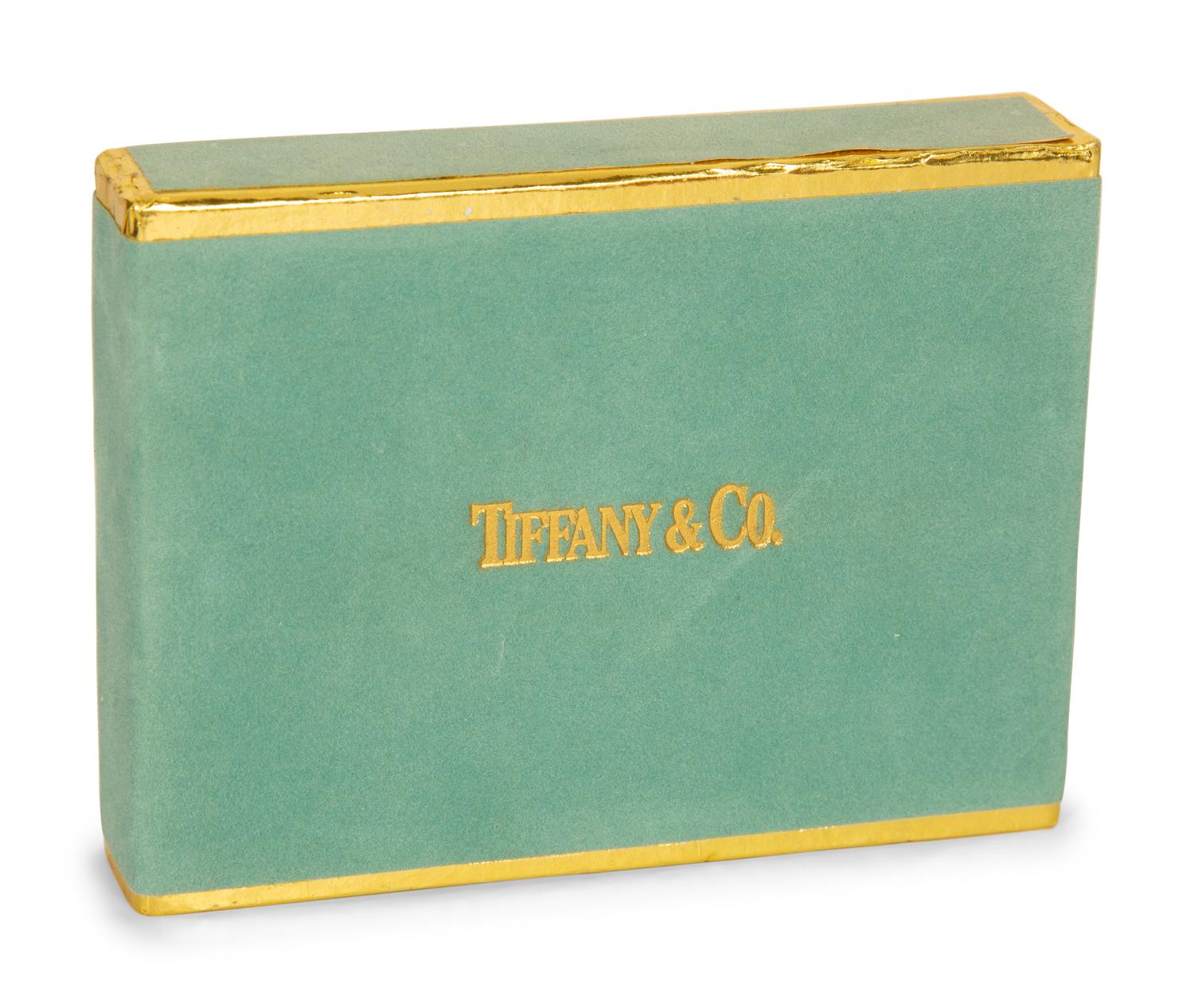 A Tiffany and Co. Travel Clock and Three Sets of Playing Cards
