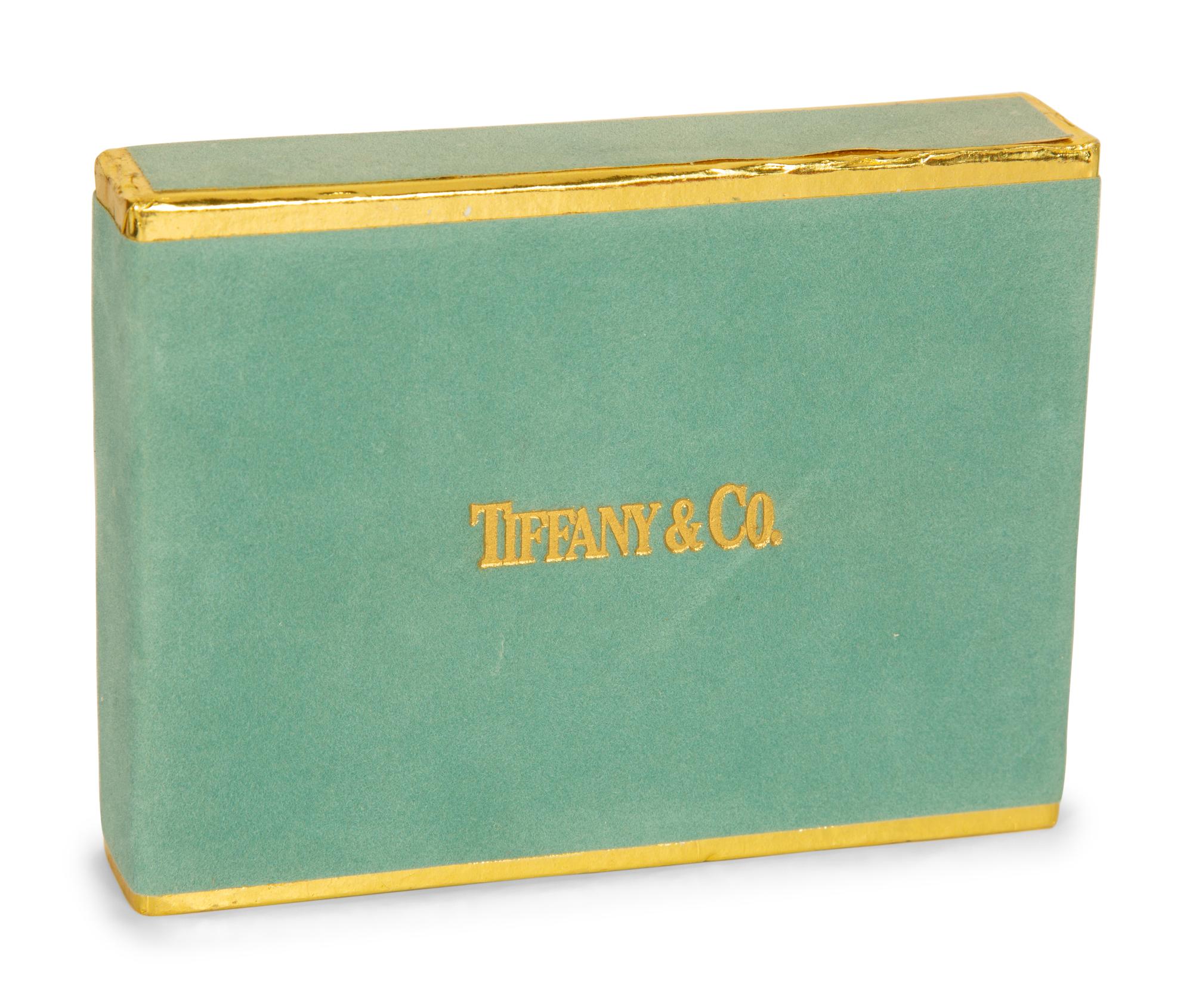 A Tiffany and Co. Travel Clock and Three Sets of Playing Cards