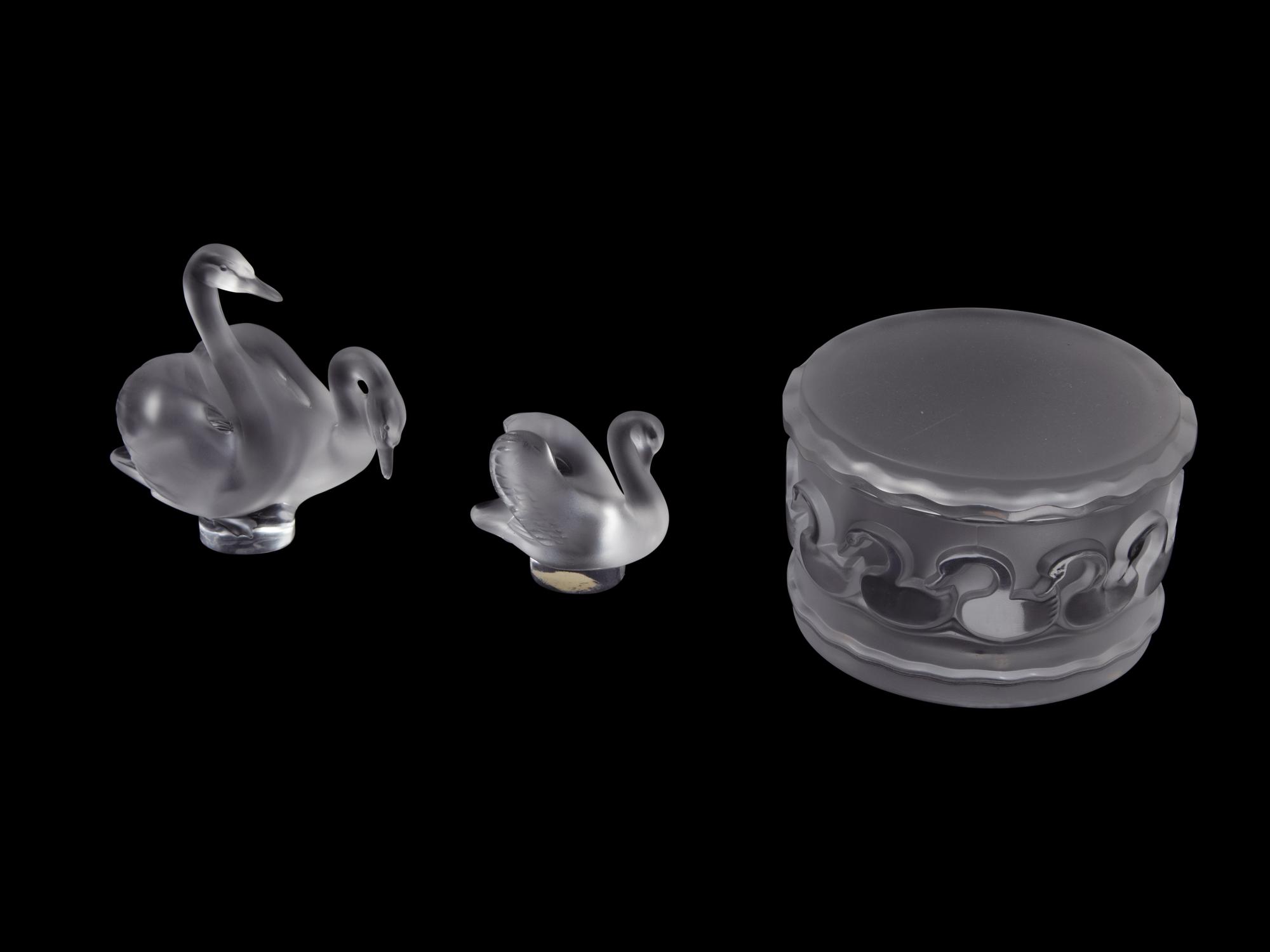 A Collection of Seven Lalique Glass Articles Height of tallest figure 5 1/2 inches.