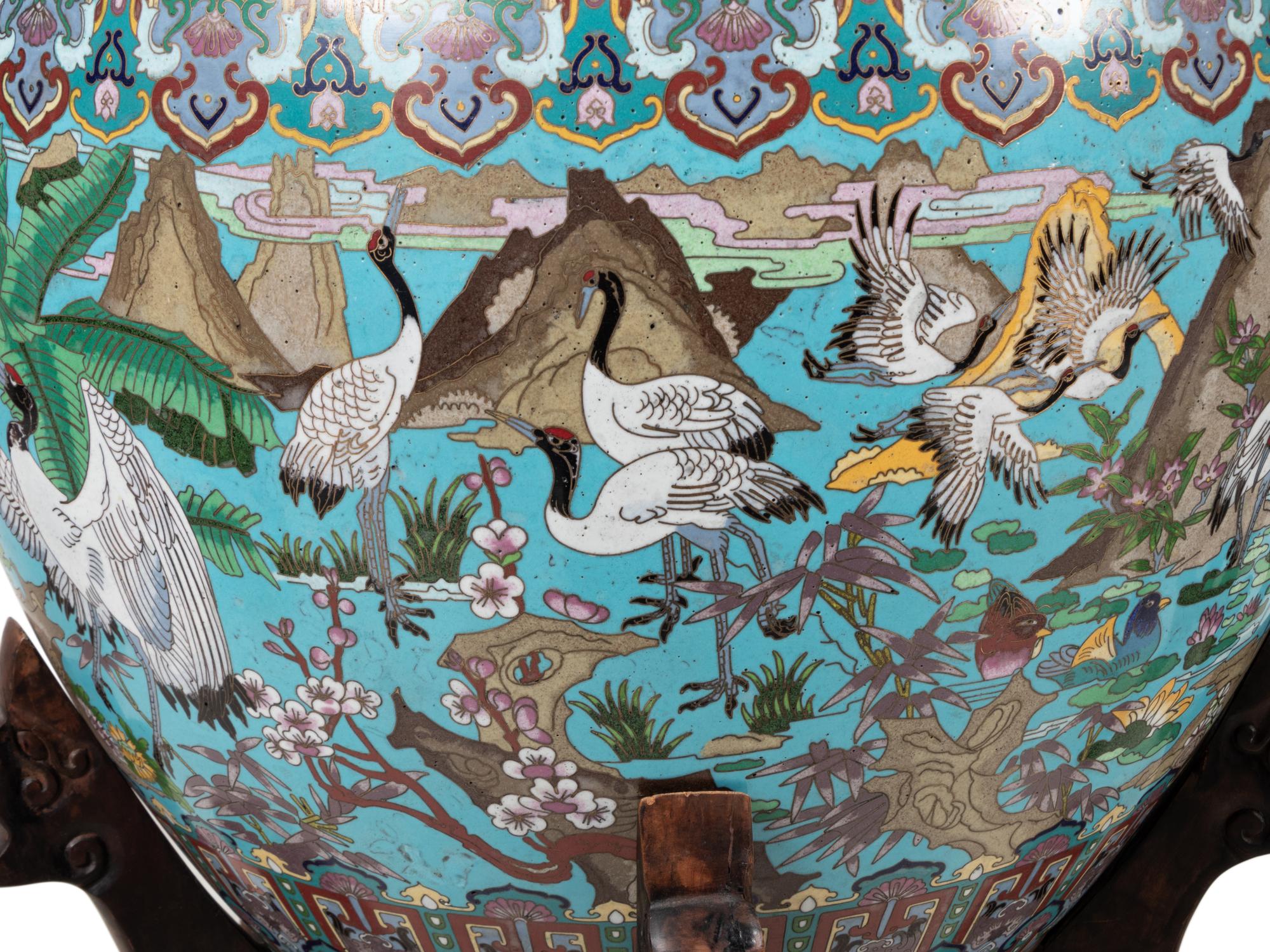 A Pair of Chinese Cloisonné Urns on Wood Stands