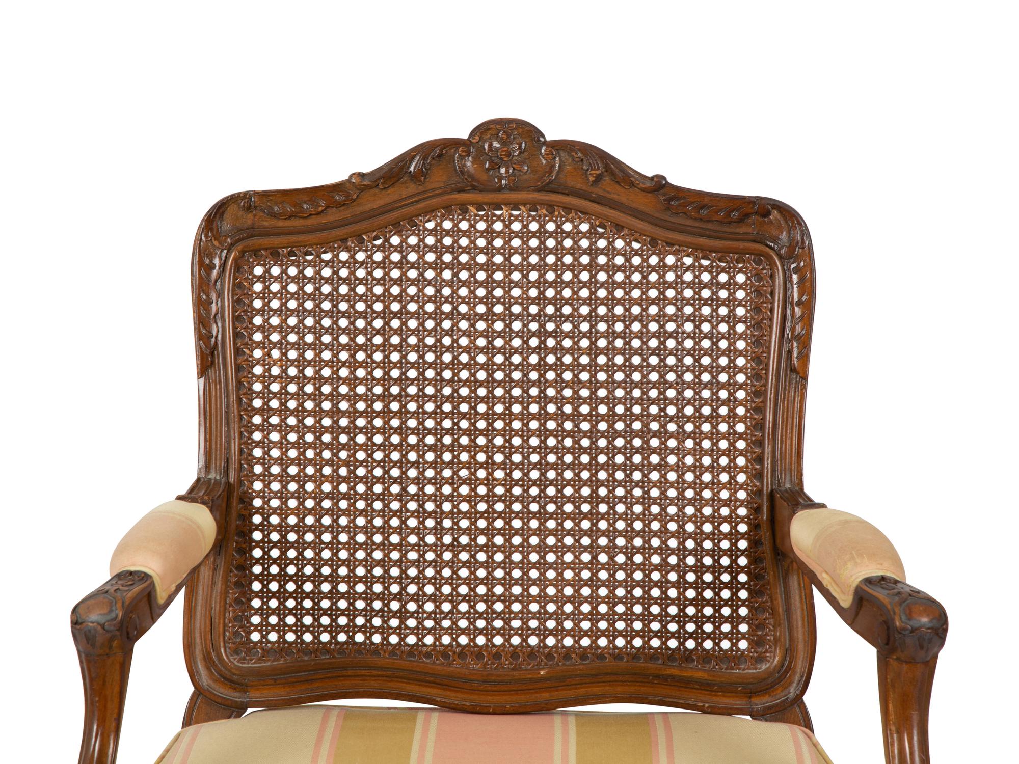 A Louis XV Style Carved Mahogany Cane Seat and Back Fauteuil — 20TH CENTURY